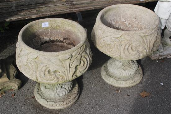 Pair stone urns on stands